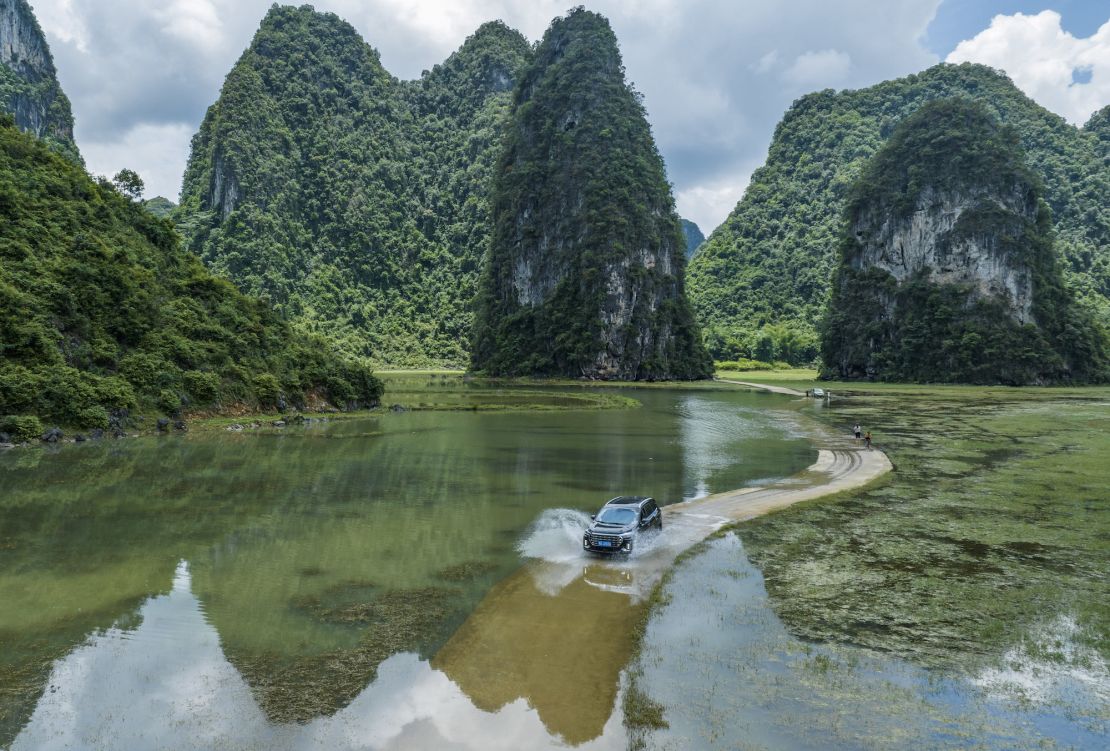 Floodwaters immerse a rural road in Chongzuo, southern China, on June 23, 2024.