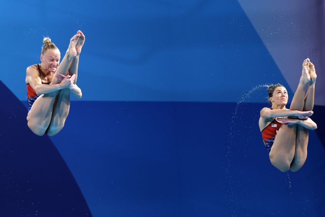 US divers Sarah Bacon, left, and Kassidy Cook compete in the synchronized 3-meter springboard event on July 27. They earned silver — <a >the United States’ first medal of this year's Games</a>. The gold went to China's Chang Yani and Chen Yiwen.