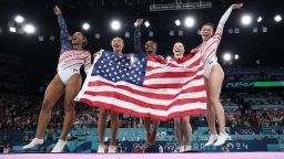 From left, American gymnasts Jordan Chiles, Hezly Rivera, Simone Biles, Jade Carey and Suni Lee celebrate after winning the gold medal at the Paris Olympics on Tuesday, July 30.