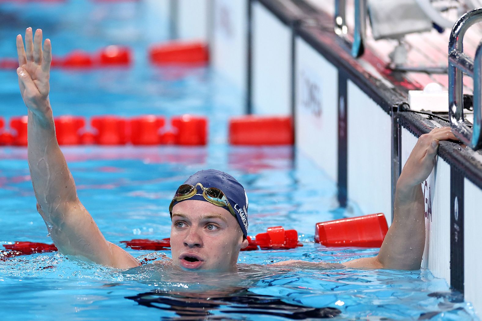 France's Léon Marchand celebrates after winning the 200-meter individual medley on Friday, August 2. It was his <a >fourth gold medal of the Games</a>, and he finished with an Olympic-record time of 1:54.06.