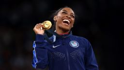 Gold medalist Simone Biles of Team United States celebrates on the podium during the medal ceremony for the Artistic Gymnastics Women's Vault Final on day eight of the Olympic Games Paris 2024 at Bercy Arena on August 03, 2024 in Paris, France.