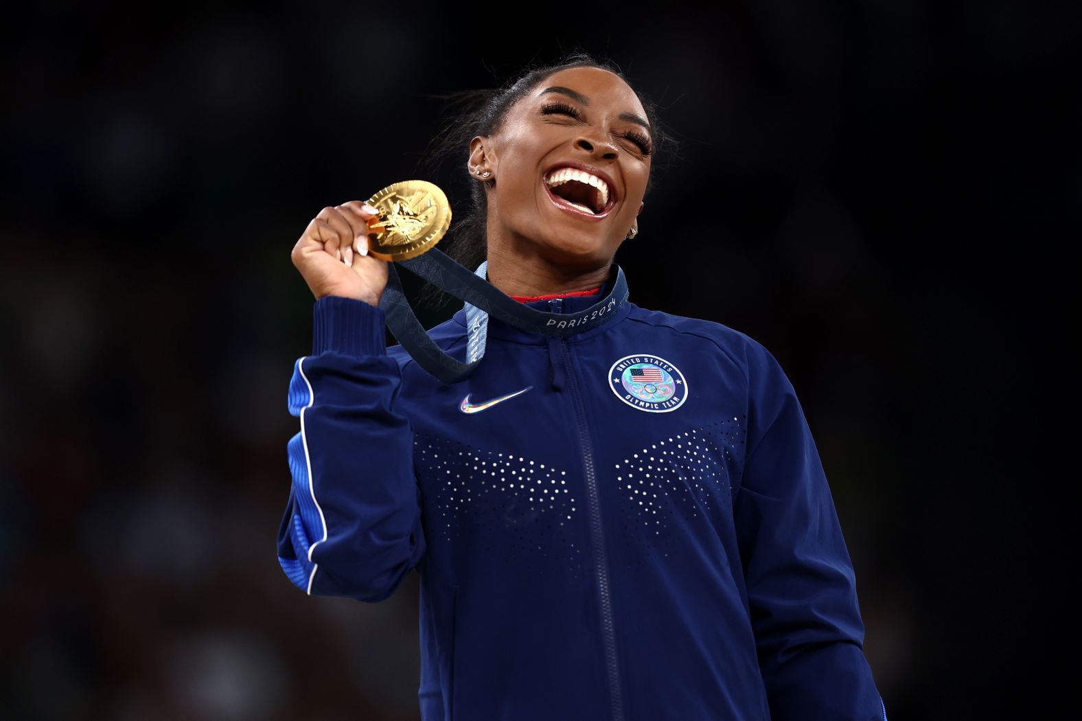 US gymnast Simone Biles celebrates with the gold medal she won in the vault on August 3. It was her third gold in Paris.