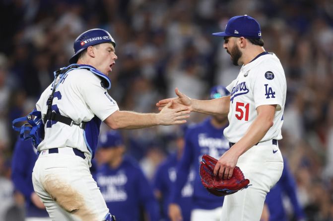 Will Smith and Alex Vesia of the Los Angeles Dodgers celebrate their 4-2 win over the New York Yankees following Game 2 of the World Series at Dodger Stadium in Los Angeles on Saturday, October 26.