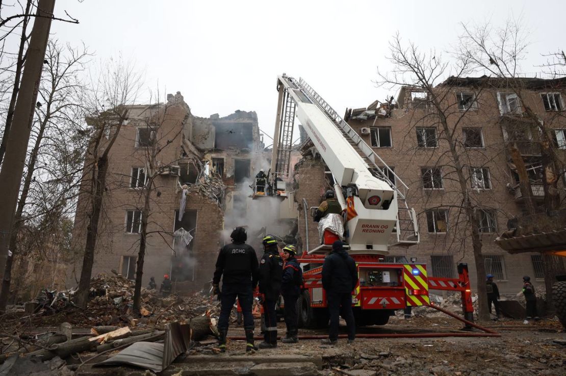 Firefighters work at the scene of the attack in Kryvyi Rih, Ukraine on November 11, 2024.