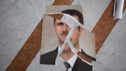 a torn portrait of bashir al-assad, which appears to have been arranged, is seen inside the presidential palace in damascus, syria, on december 10, 2024.
