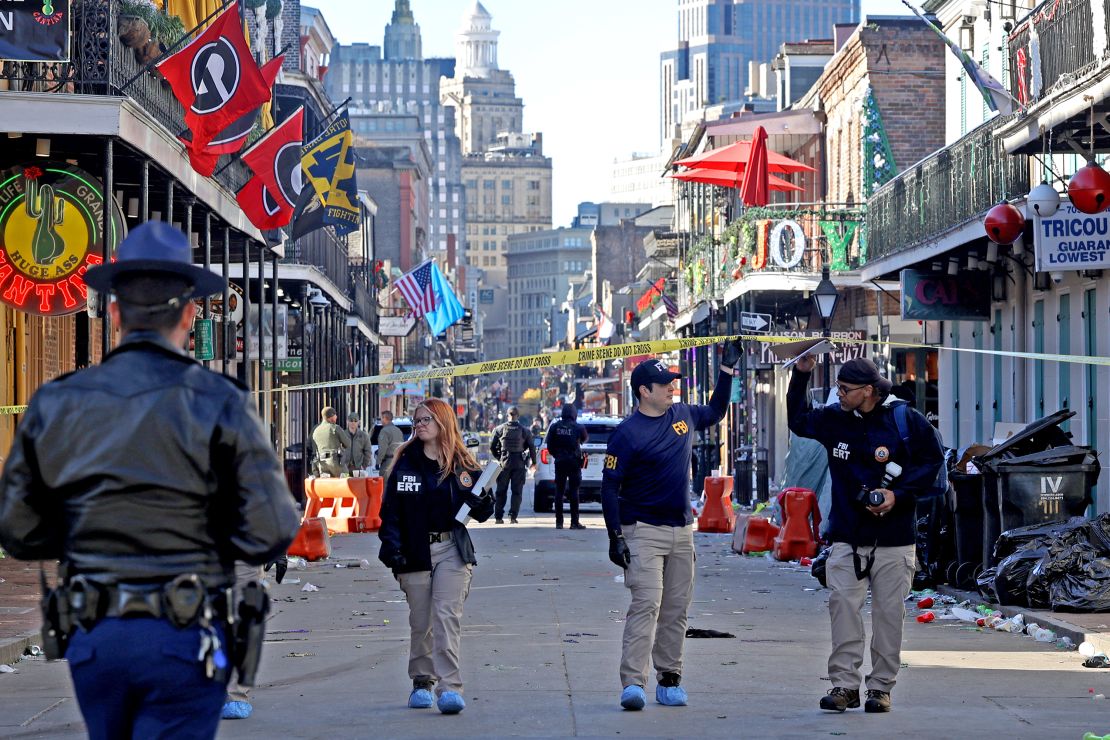 Law enforcement officers from multiple agencies are on the scene after a truck ramming attack that killed 14 people on Bourbon Street in New Orleans on New Year's Day.