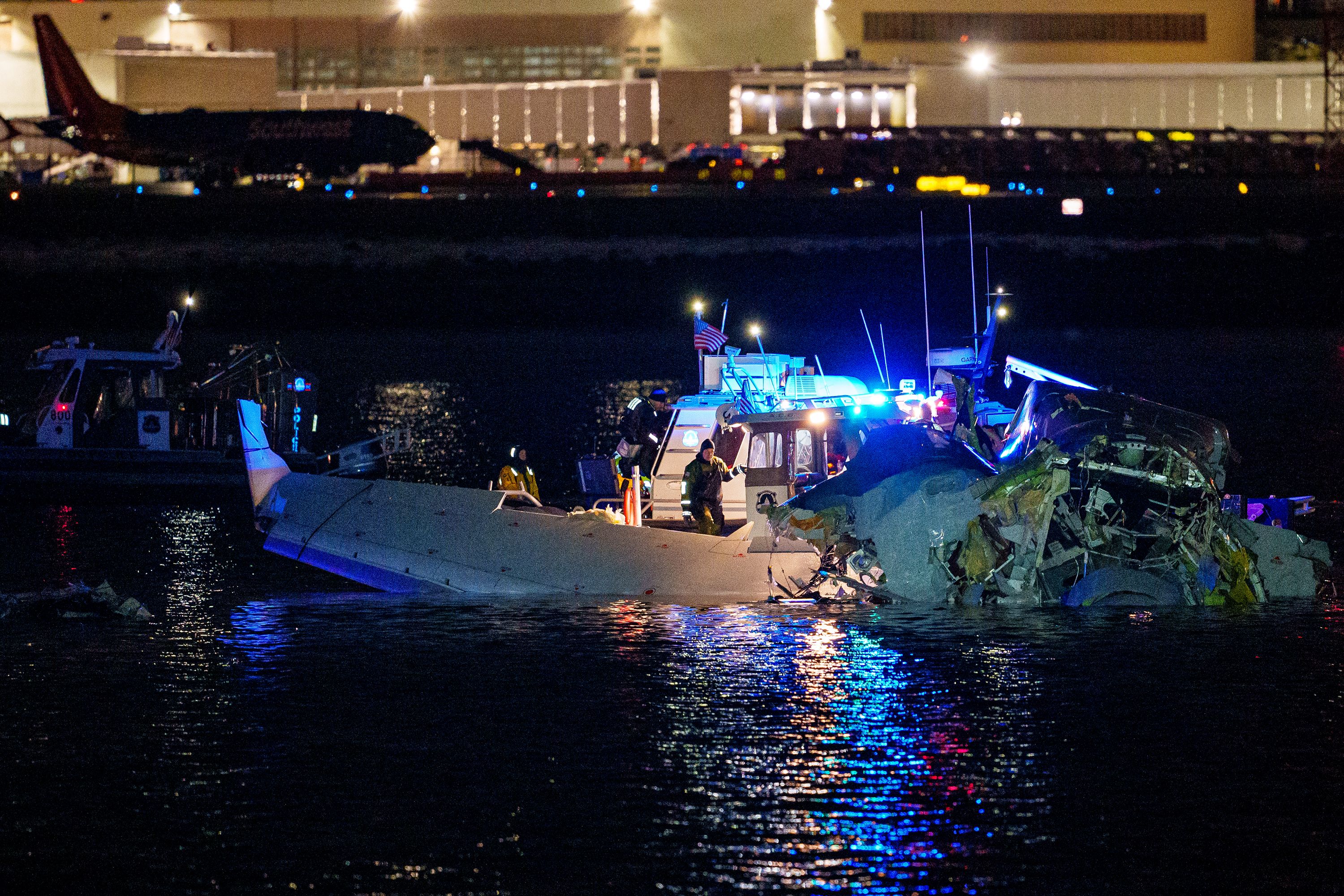 Emergency response units assess wreckage in the Potomac River on Thursday, January 30, after a passenger jet and a US Army helicopter collided near Washington, DC.