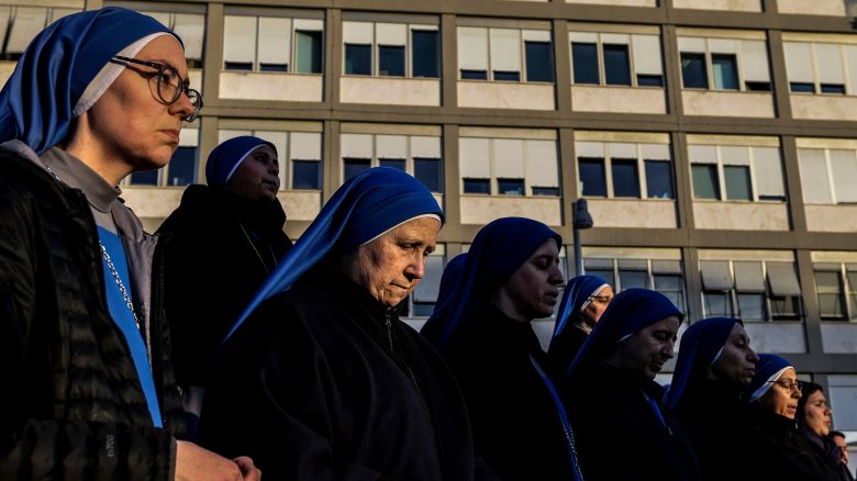 ROME, ITALY - FEBRUARY 22: Nuns pray during a Rosary service in front of the Gemelli hospital, on February 22, 2025 in Rome, Italy. Pope Francis was hospitalized in Rome last week with bronchitis, and was subsequently treated for a respiratory tract infection. Today's official bulletin released by the Vatican Press Office states that the condition of the Holy Father continues to be critical. This morning, the Pontiff experienced an asthma-like respiratory crisis of prolonged intensity, which required the administration of high-flow oxygen. Today's blood tests also revealed thrombocytopenia, associated with anemia, which required the administration of blood transfusions. (Photo by Alessandra Benedetti - Corbis/Corbis via Getty Images)
