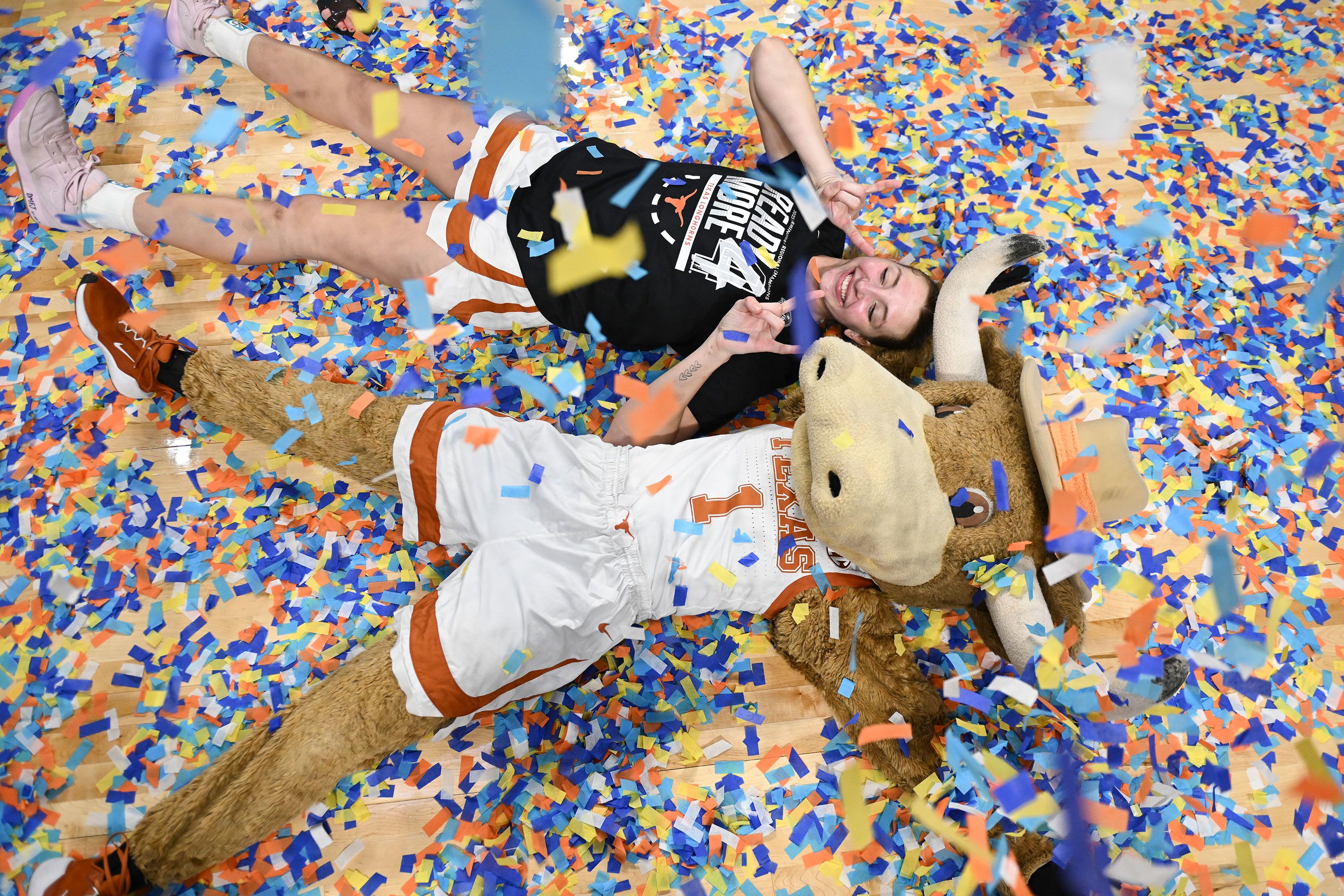 Texas’ Taylor Jones celebrates with Hook ‘Em the mascot on Monday, March 31, after the Longhorns <a href="https://www.cnn.com/2025/03/31/sport/ncaa-womens-basketball-elite-eight-03-31-25-spt/index.html">defeated TCU</a> to clinch a spot in the Final Four.