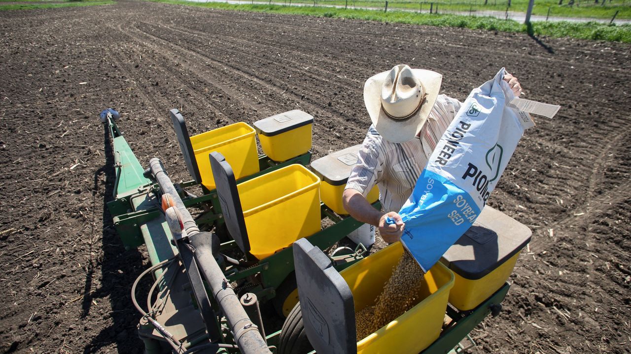 A worker prepares soybeans for planting at a farm in Tiffin, Iowa, on May 6.