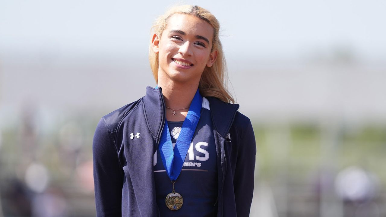 Transgender athlete A.B. Hernandez of Jurupa Valley poses with gold medal after winning the girls long jump during the CIF Southern Section Masters Meet at Moorpark High School on May 24, 2025 in Moorpark, California.