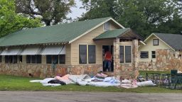 In this photo taken on July 5, 2025, in Hunt, Texas, Michael McCown, father of Linnie McCown, 8, walks into the "Bubble Inn" cabin at Camp Mystic, after severe flooding. Fears grew on July 9, 2025, that the death toll of 110 in the Texas floods could still surge as hopes fade of finding survivors among the many reported still missing several days after the disaster. More than 170 people remain unaccounted for after the flash flooding on the Fourth of July holiday, a tragedy that shocked many Americans. Camp Mystic, an all-girls camp located next to the Guadalupe River, confirmed that 27 girls and counselors at the summer camp died in the flooding. (Photo by Moisés ÁVILA / AFP) (Photo by MOISES AVILA/AFP via Getty Images)