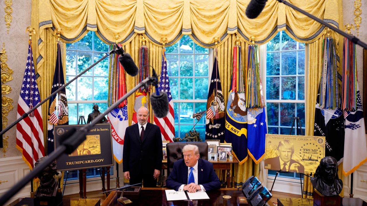 President Donald Trump, accompanied by US Commerce Secretary Howard Lutnick, speaks after signing an executive order in the Oval Office at the White House on Friday, September 19,  in Washington, DC. Trump signed two executive orders, establishing the "Trump Gold Card" and introducing a $100,000 fee for H-1B visas.