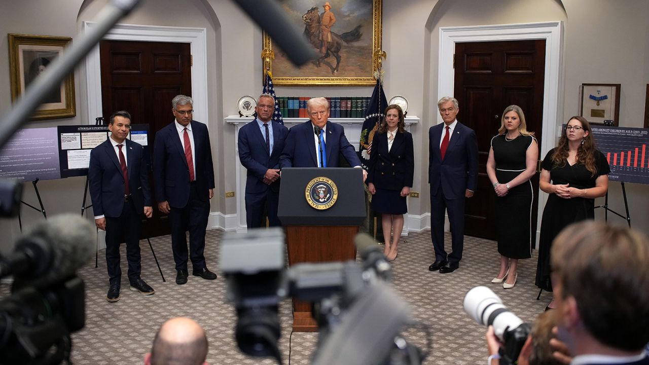 President Donald Trump (C) answers questions after making an announcement on “significant medical and scientific findings for America’s children” in the Roosevelt Room of the White House on Mondaym, September 22, in Washington, DC.