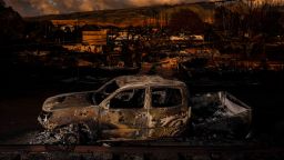 The remains of a vehicle in a burned neighborhood after wildfires in Lahaina, Maui, Hawaii on Friday, August 18, 2023. (Bryan Anselm/New Jersey State Council for the Arts Fellowship/Redux)