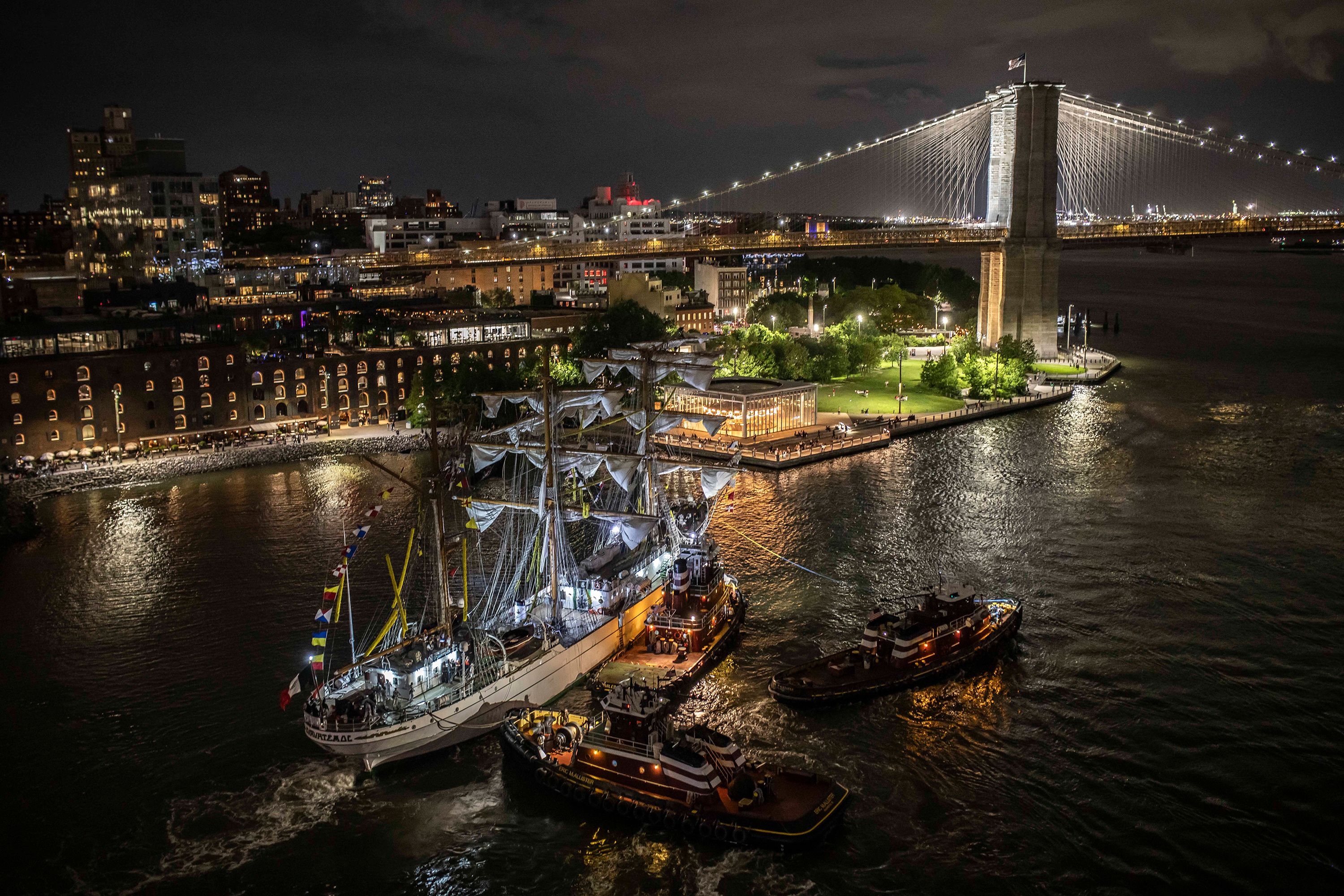 The Mexican Navy ship Cuauhtémoc is surrounded by emergency responders after it collided with the Brooklyn Bridge in New York on Saturday, May 17.