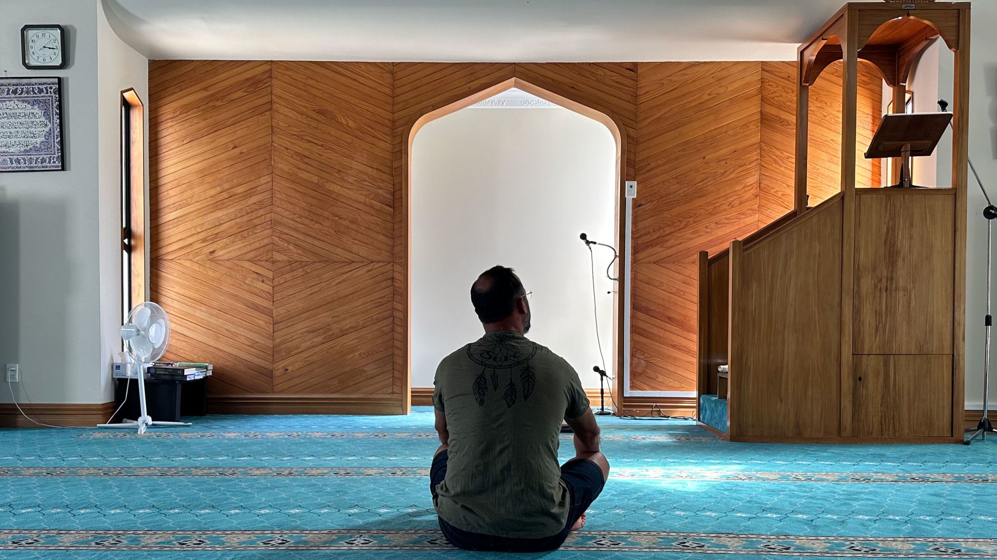 Temel Ataçocuğu sits last month in the spot where he was shot nine times by a White supremacist in 2019 at Al Noor Mosque in Christchurch, New Zealand.