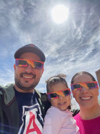 Juan M. Soto Peña (left) watched the eclipse with his daughter, Luciana, and wife, Fabiola, at home in Tucson, Arizona.