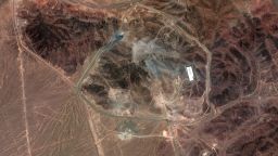 This satellite image shows the Fordow nuclear facility in Iran on June 24, 2025. The image shows new damage to the facility caused by June 23 strikes, including craters along the access roads that lead to the tunnel entrances and the Fordow underground complex. Multiple craters are visible at several of the tunnel openings and several buildings along the northeastern perimeter road have been destroyed. An additional crater is seen in the middle of the access road to the northwest of the facility. 
