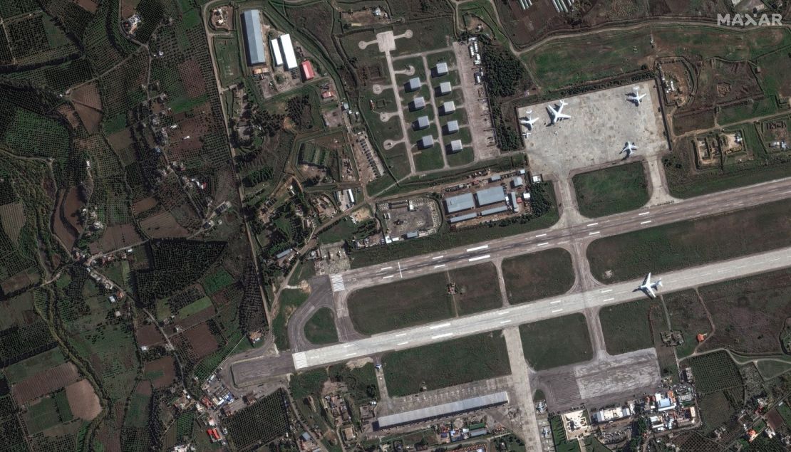 A satellite image captured on Dec. 13 by Maxar appears to show Russian military planes loading equipment at Khmeimim airbase in western Syria.