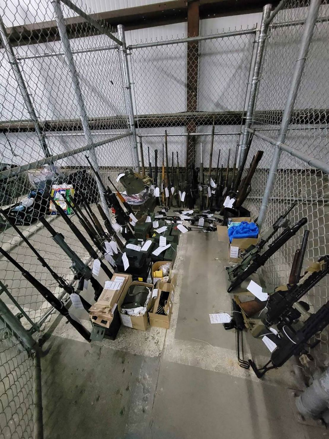 A cache of firearms seized by police officers during searches in January 2024.