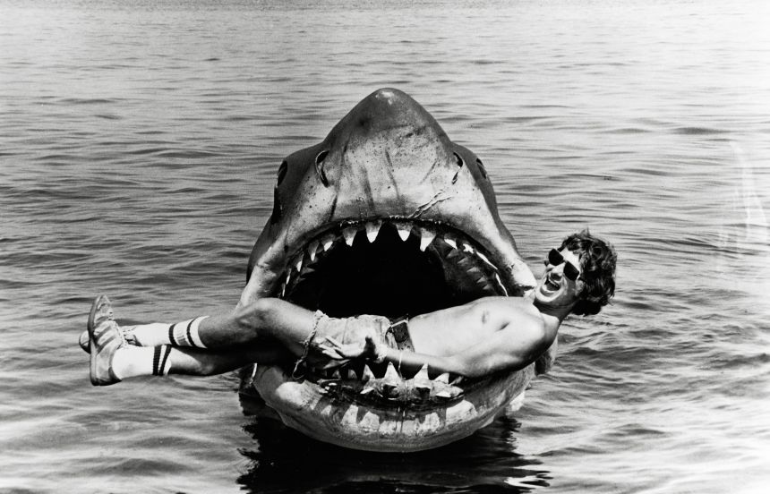 Steven Spielberg relaxes inside the mouth of the mechanical shark from his film “Jaws.”
