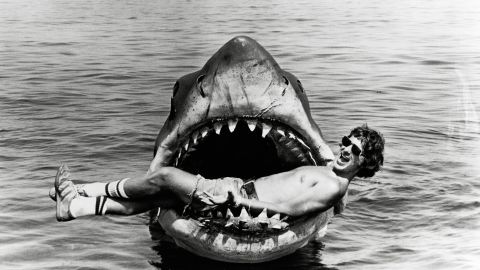 Director Steven Spielberg relaxes inside the mouth of the mechanical shark that played his film's villain. Crew reportedly nicknamed the shark Bruce, after Spielberg's lawyer, Bruce Ramer.