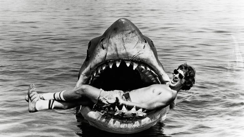 Director Steven Spielberg relaxes inside the mouth of the mechanical shark that played his film's villain. Crew reportedly nicknamed the shark Bruce, after Spielberg's lawyer, Bruce Ramer.