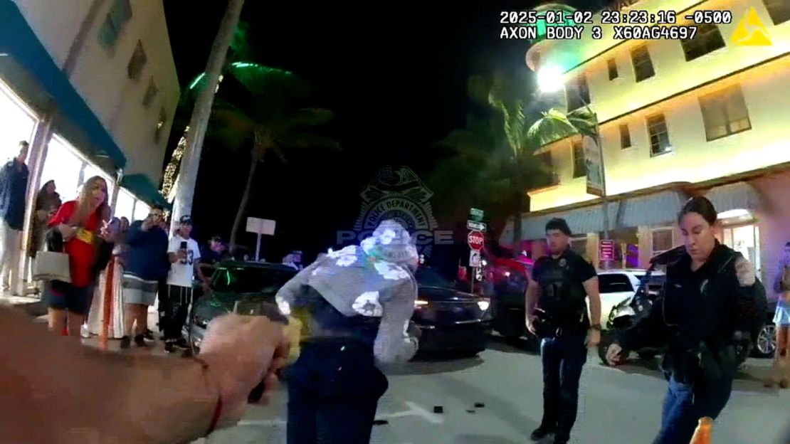 In a still from body camera footage released by the Miami Beach Police Department, Fred Kerley is hit with a dart-firing stun gun by police officers.