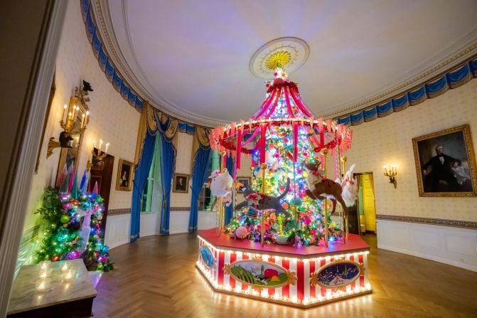 The Blue Room showcases the official White House Christmas Tree. This year’s tree is an nearly 19-foot Fraser Fir from North Carolina and stands floor to ceiling. Every year, the Blue Room chandelier is removed to accommodate the Christmas tree’s full height.