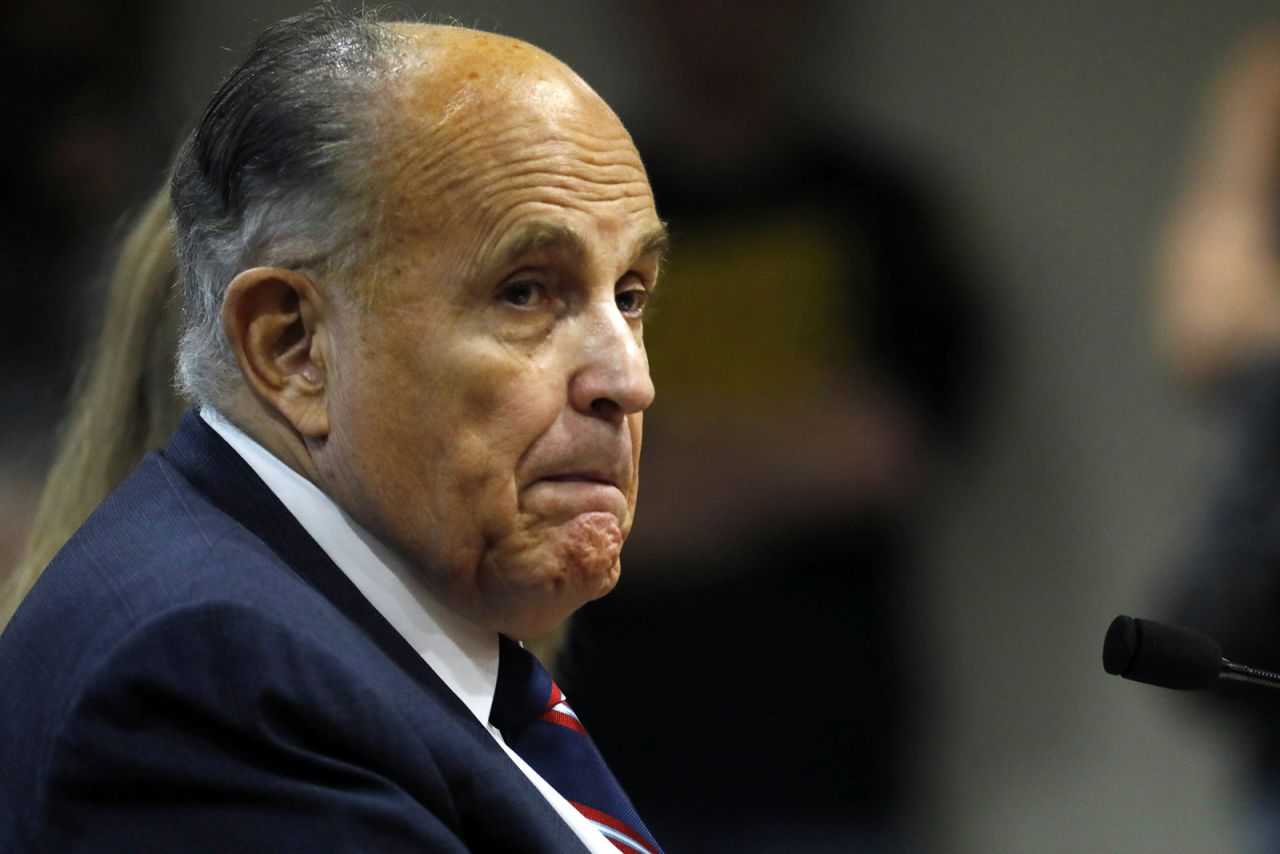 Rudy Giuliani looks on during an appearance before the Michigan House Oversight Committee in Lansing, Michigan on Dec. 2.