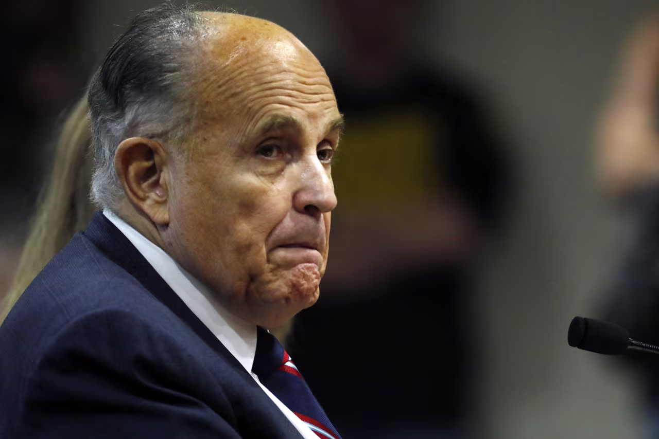 Rudy Giuliani looks on during an appearance before the Michigan House Oversight Committee in Lansing, Michigan on Dec. 2.