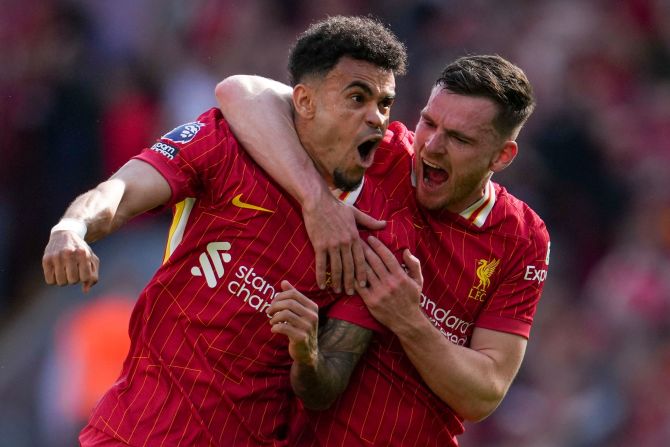 Liverpool's Luis Díaz, left, celebrates with Andrew Robertson after scoring a goal against Tottenham in Liverpool, England, on Sunday, April 27. Liverpool’s decisive 5-1 victory <a  target="_top" href="/newspapers?url=https://www.cnn.com/2025/04/27/sport/liverpool-premier-league-title-spt/index.html">clinched the Premier League title</a>. It is the club’s 20th top-flight league title, tying Manchester United for the most in England.
