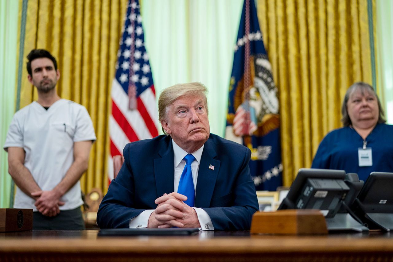 US President Donald Trump talks to reporters after signing a proclamation honoring National Nurses Day in the Oval Office at the White House on Wednesday.