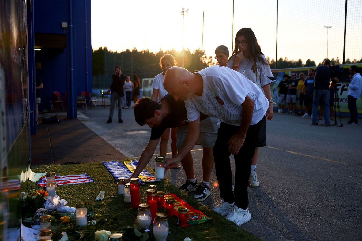 People place candles outside Gondomar’s stadium on Thursday.