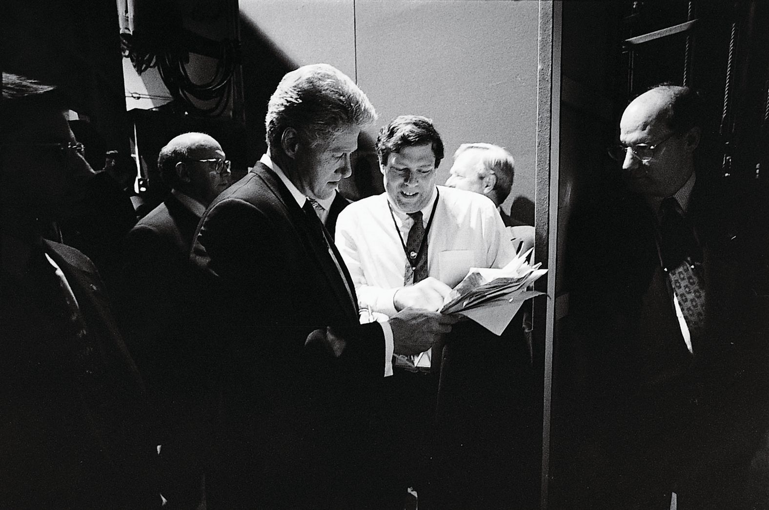 Clinton is shown some poll numbers by Mark Penn as he prepares for a debate in San Diego in 1996.
