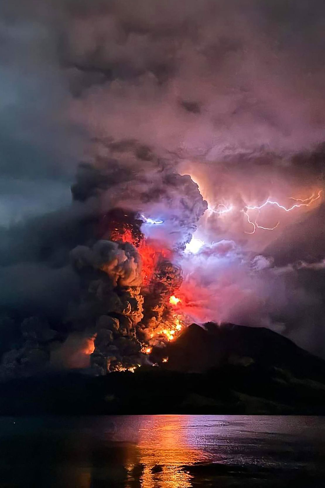 Indonesia's Mount Ruang spews hot lava and smoke in April 2024.