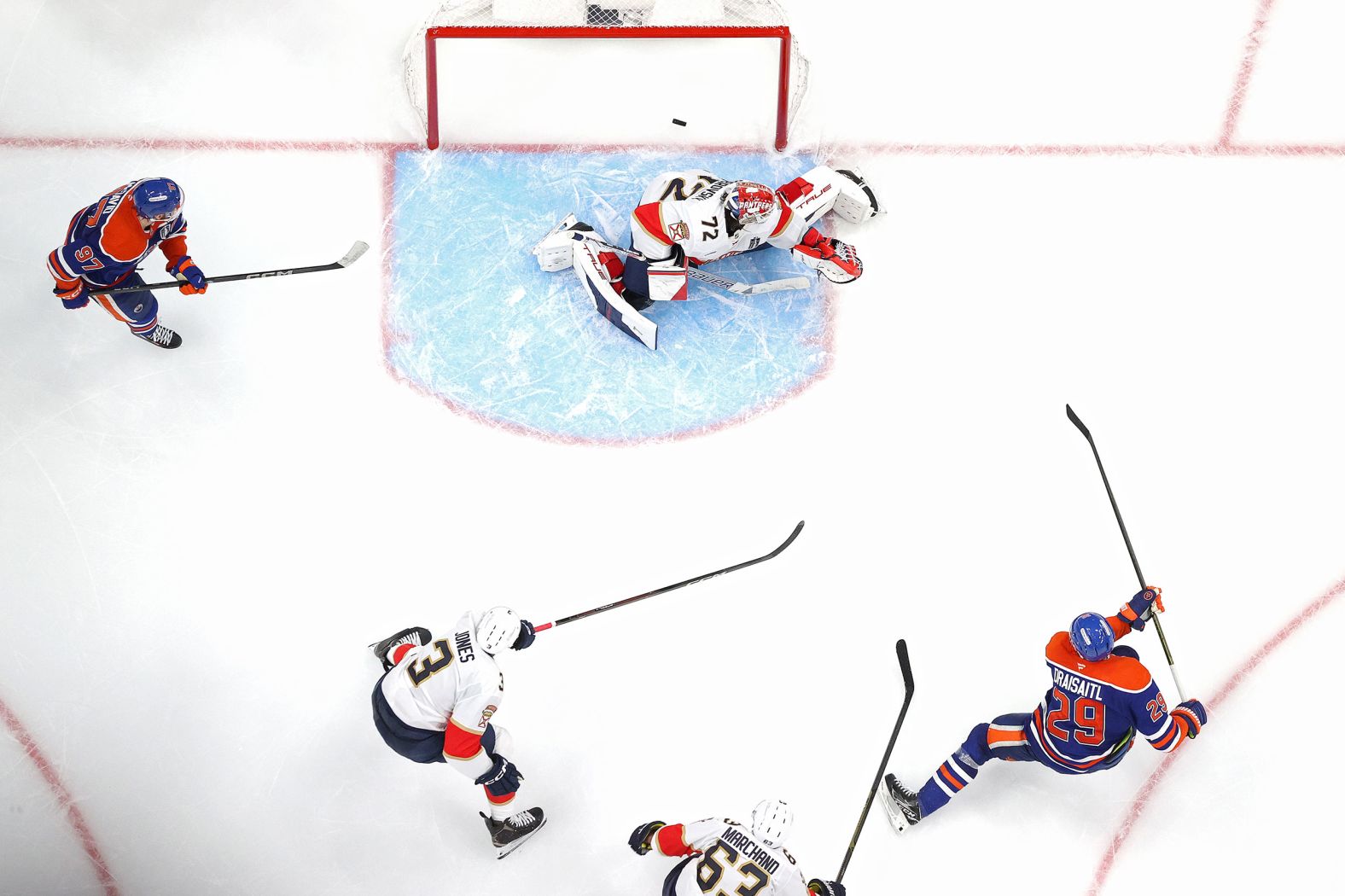 The Edmonton Oilers’ Leon Draisaitl, right, scores in overtime to lift his team to a 4-3 victory over Florida in <a href="index.php?page=&url=https%3A%2F%2Fwww.cnn.com%2F2025%2F06%2F05%2Fsport%2Foilers-panthers-game-1-stanley-cup-final-spt">Game 1 of the NHL’s Stanley Cup Final</a> on Wednesday, June 4. The same two teams played in last year’s final. Florida came out on top.