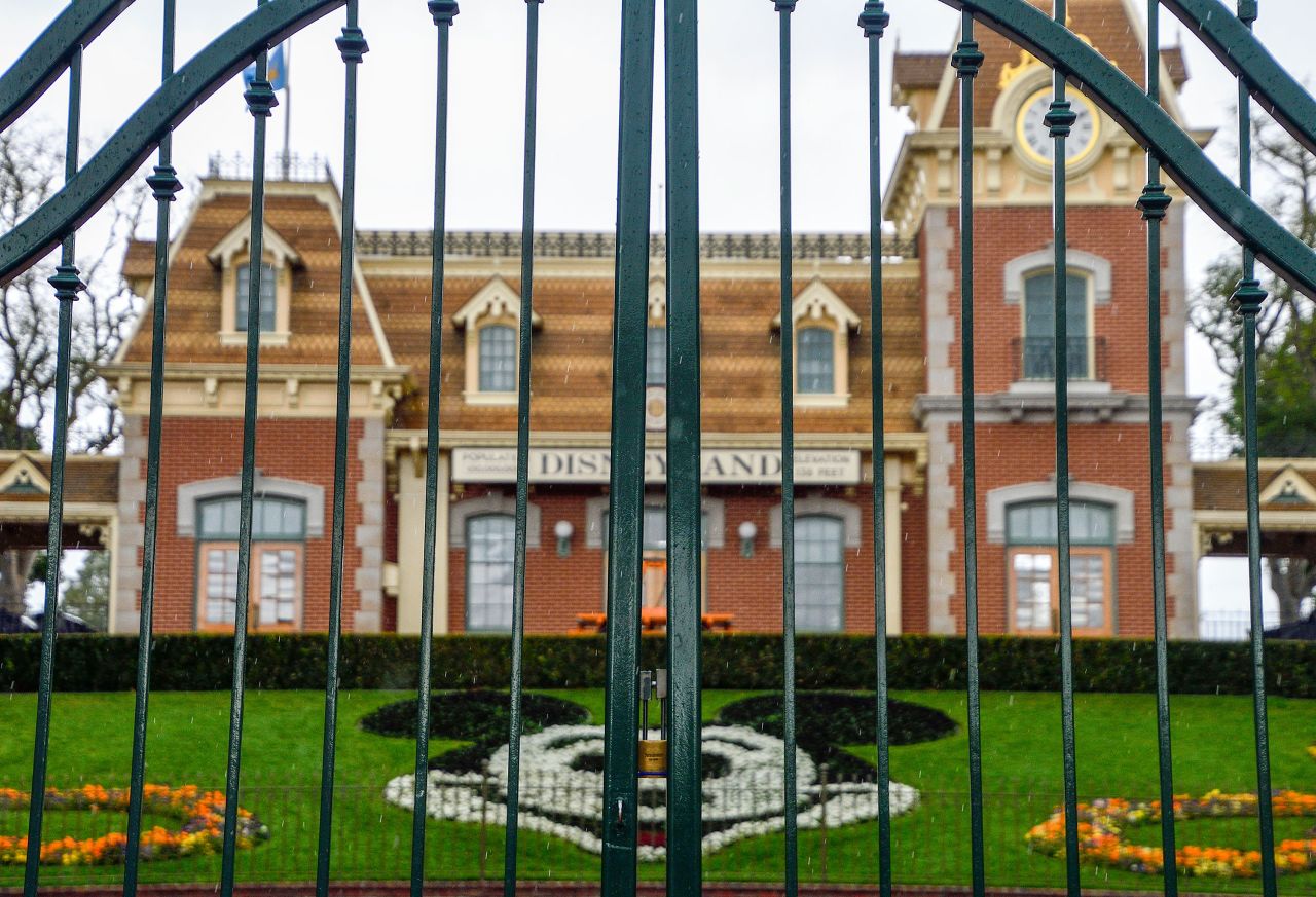 A lock hangs on a gate at the entrance to Disneyland in Anaheim, California on March 16.