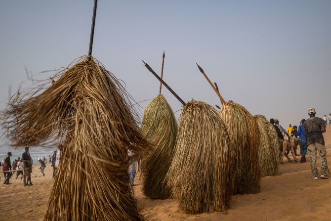 Kumpos, a traditional figure and dance from the Jola people of the Casamance region of Senegal and Gambia, perform in Dakar, Senegal, on Sunday, April 27.