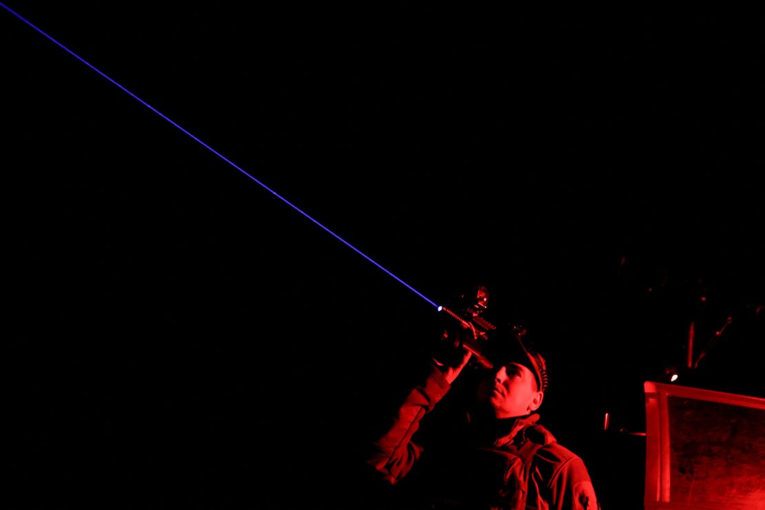 A serviceman from the mobile air defence unit of the 115th Separate Mechanized Brigade of the Ukrainian Armed Forces observes the sky during an overnight shift on June 1 in the Kharkiv region of Ukraine.