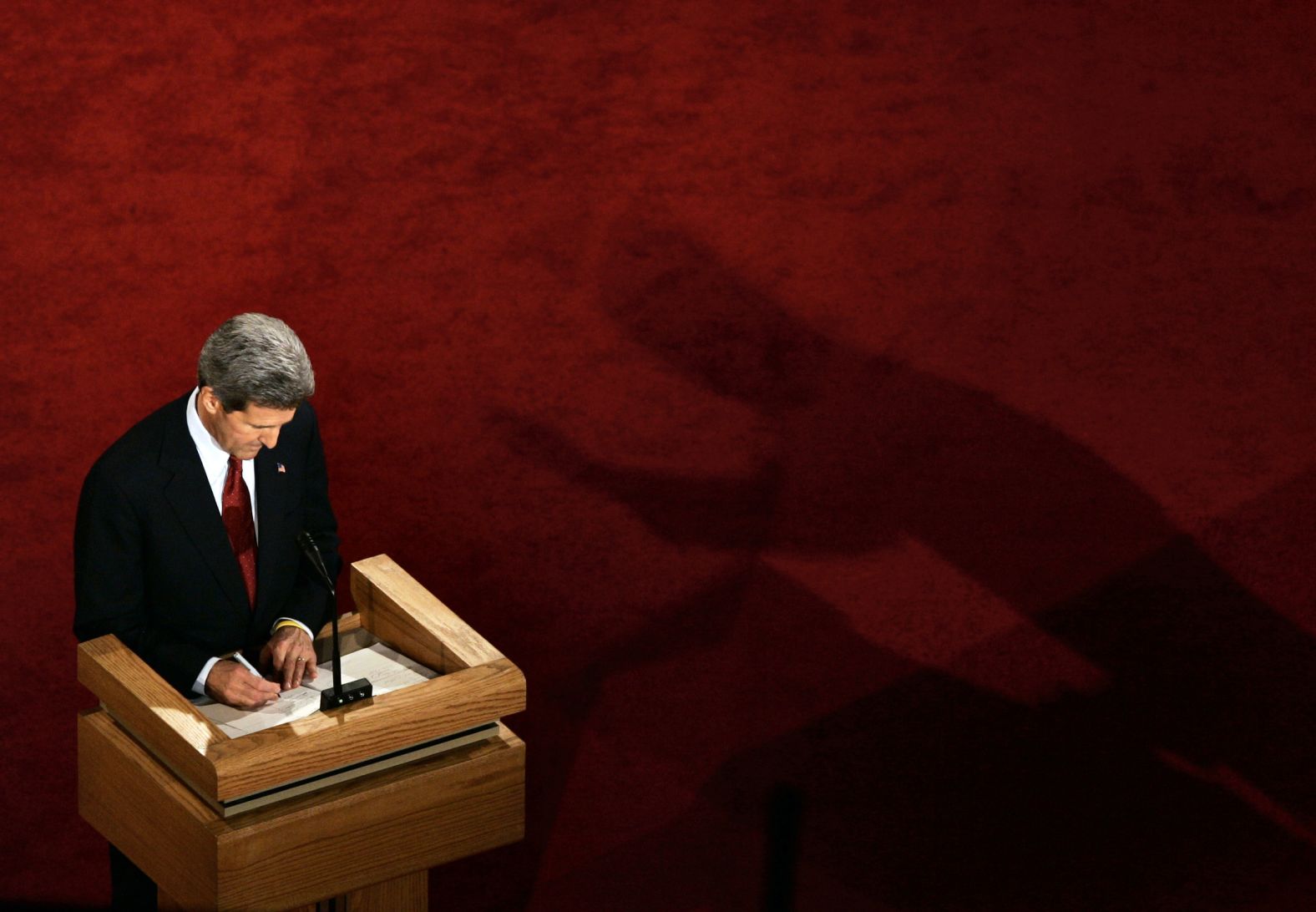 Bush's shadow is seen near challenger John Kerry during a debate in 2004.