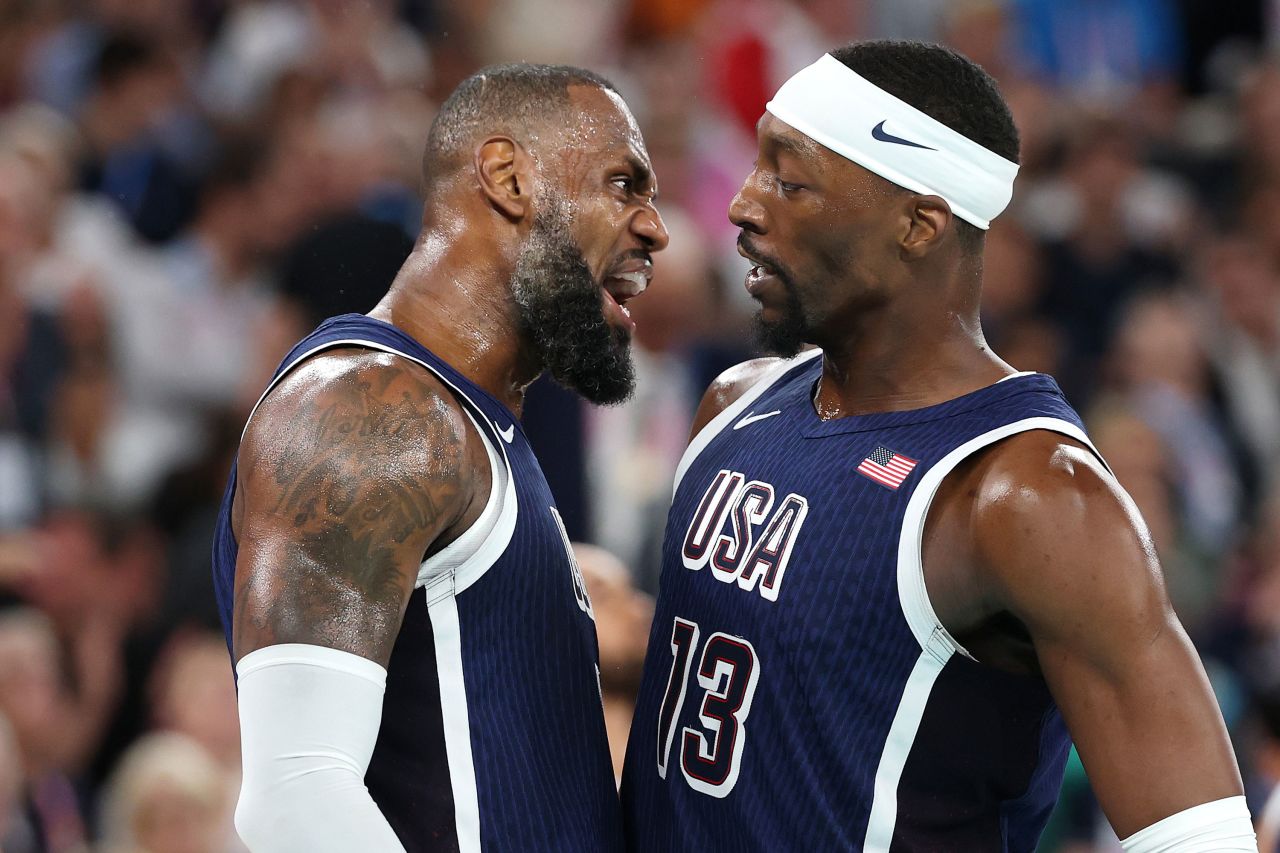 James celebrates with Bam Adebayo. Michael Reaves/Getty Images