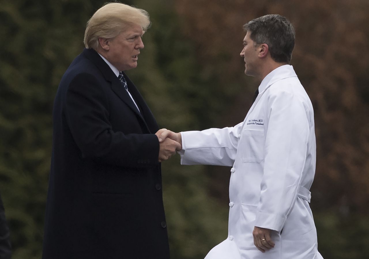 Trump shakes hands with White House Physician Rear Admiral Dr. Ronny Jackson, following his annual physical in January.