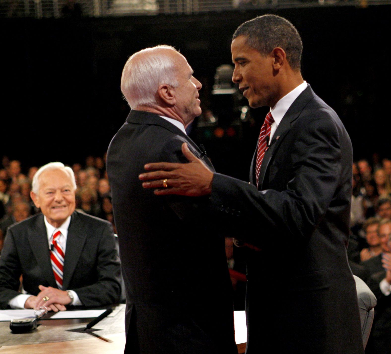 Barack Obama, right, and John McCain shake hands at the start of a presidential debate in 2008.