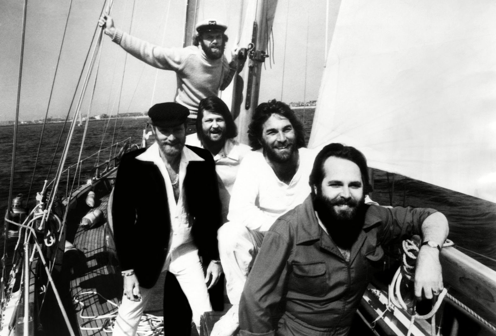 The Beach Boys on a boat in 1978. From left, in front, are Love, Brian Wilson, Dennis Wilson and Carl Wilson. Jardine is in the back.