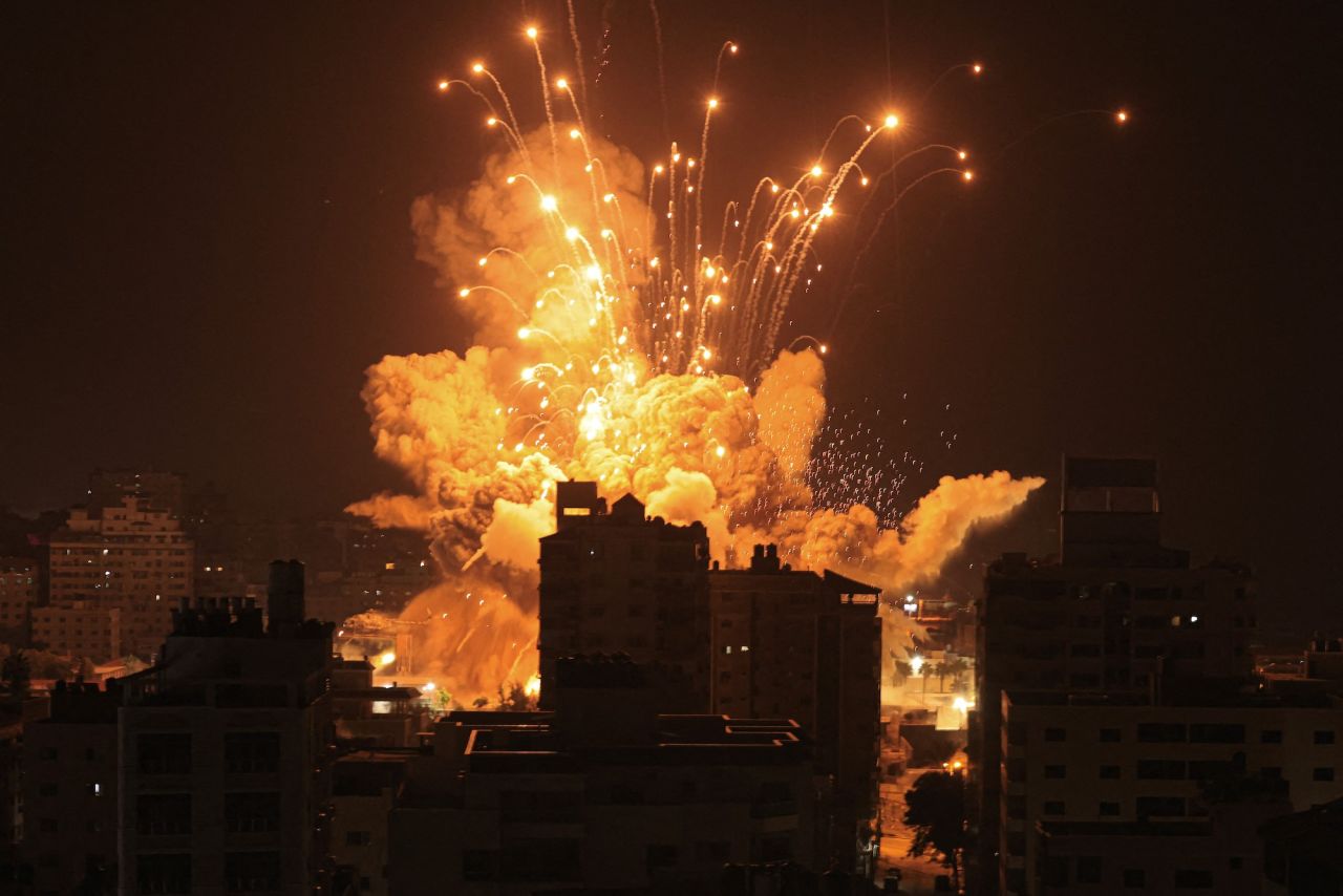 A missile explodes in Gaza City during an Israeli air strike on Sunday.