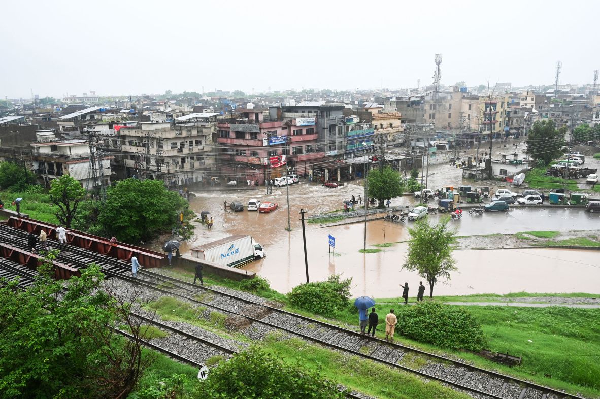 People look down at flooded streets in Rawalpindi, Pakistan, on July 17.