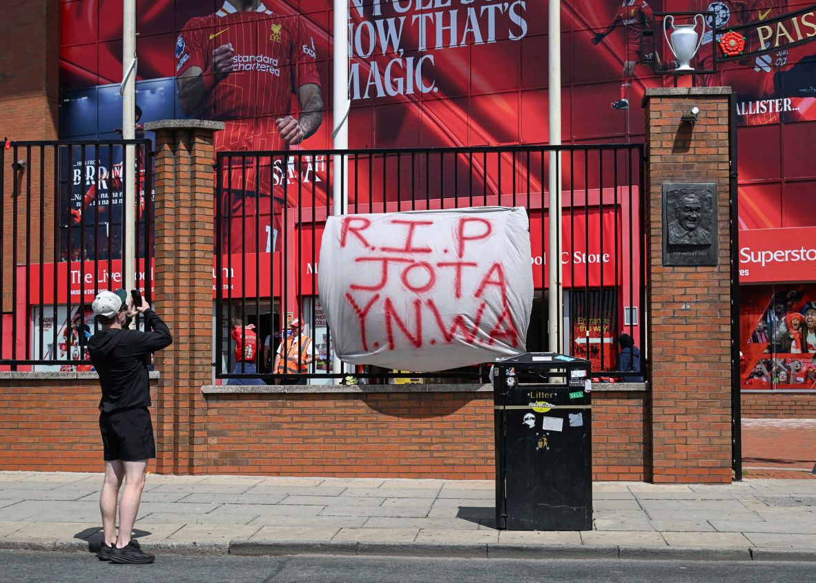 A banner referencing Liverpool’s iconic anthem — “You’ll Never Walk Alone” — is seen outside Anfield on Thursday.