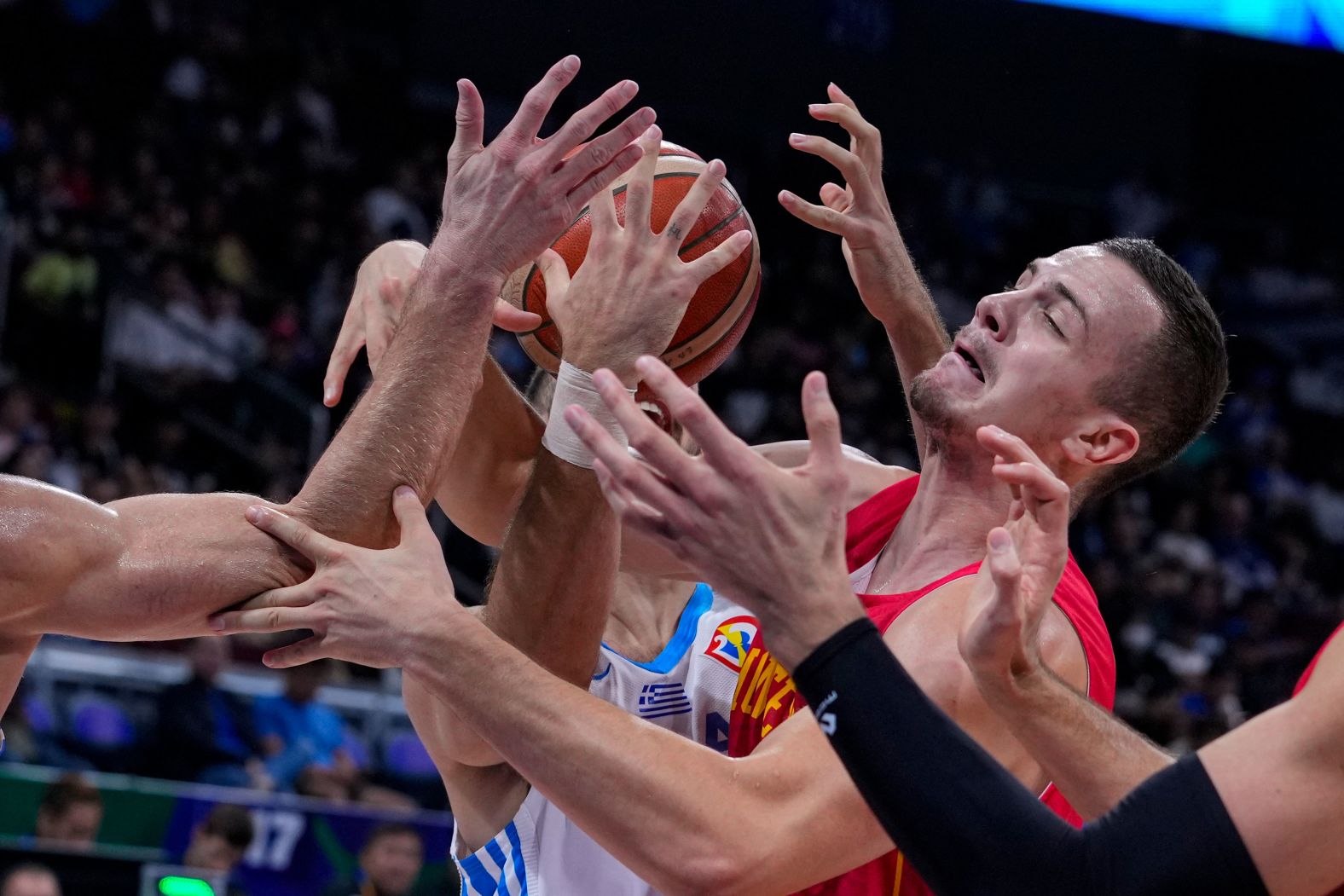 Montenegro center Marko Simonović competes for a rebound during a World Cup game against Greece on Sunday, September 3.